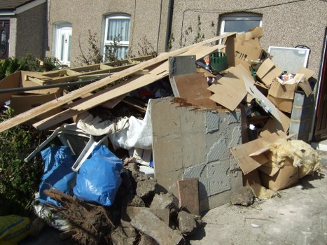 Garden workers removing debris